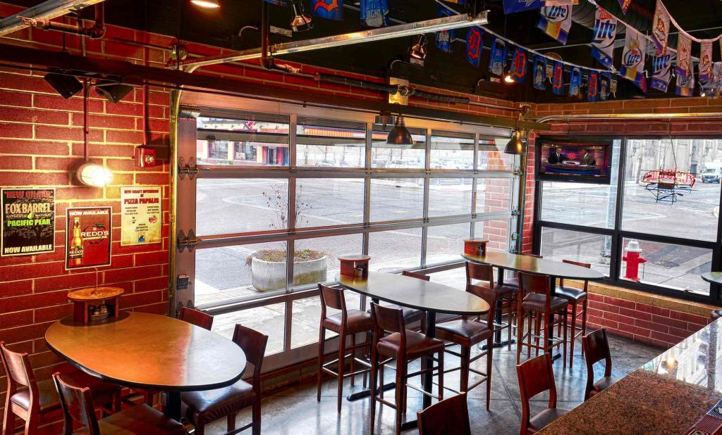 Full-view aluminum glass door in a restaurant